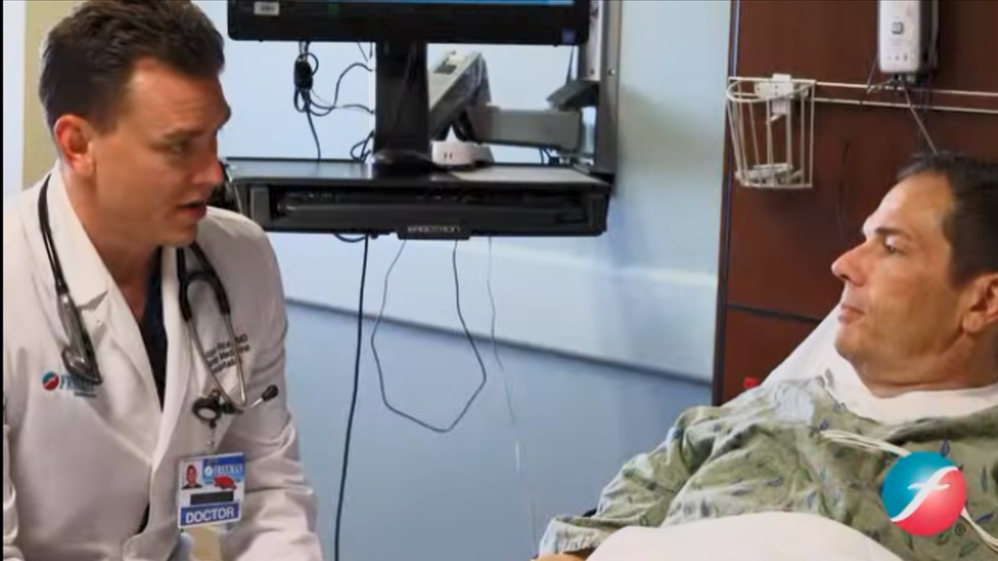 Dr. Logan Rice at a patient bedside during the MyFreemanHealth commercial